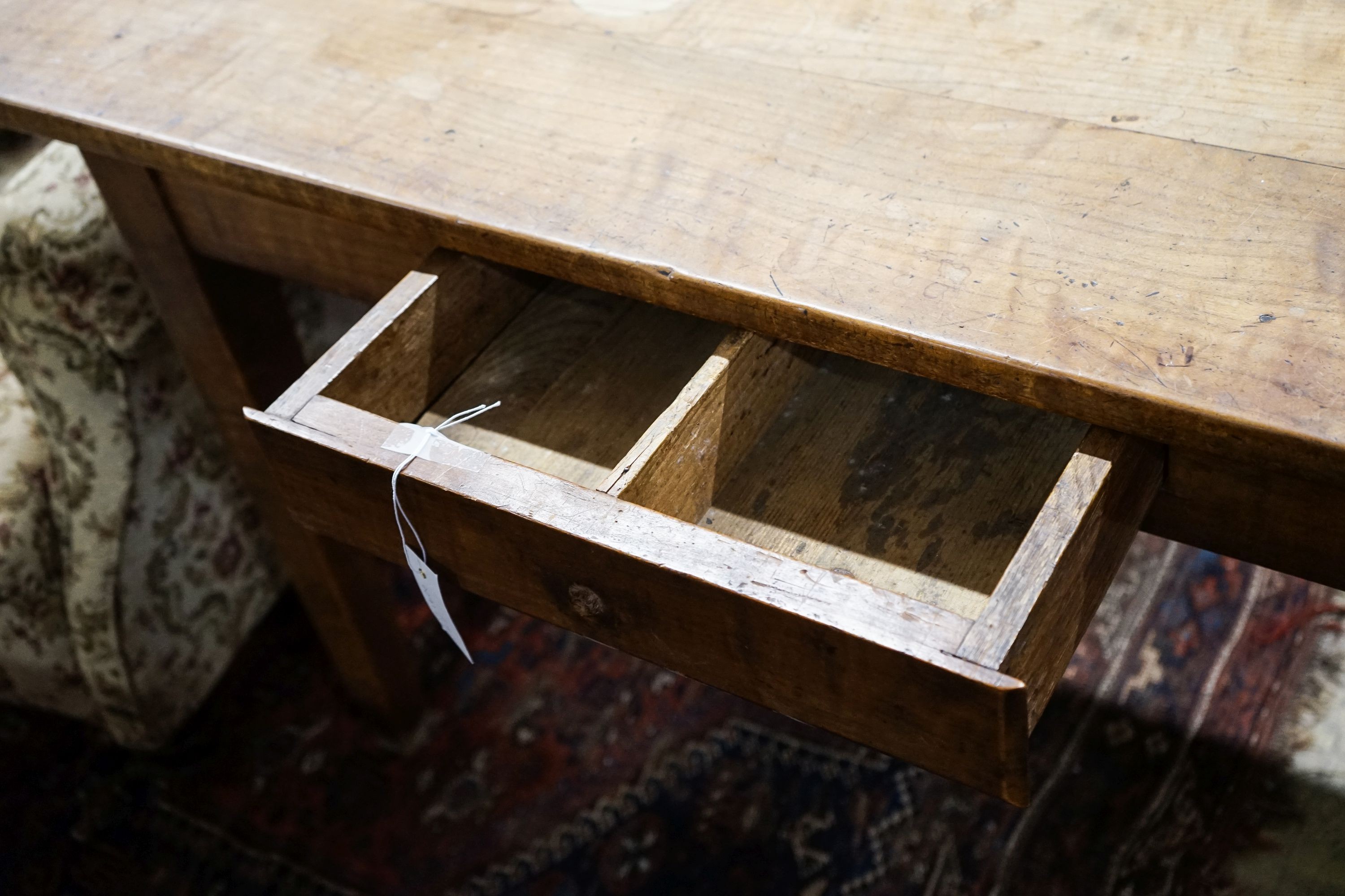 A 19th century French fruitwood and cherry farmhouse side table, width 130cm, depth 69cm, height 76cm